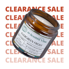 Load image into Gallery viewer, Candle jar labeled 'Evergreen Frost' by The Scented Vine with a clearance sale text overlay.