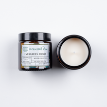 Load image into Gallery viewer, Holiday Candle in an Amber jar with a label that reads Evergreen Frost