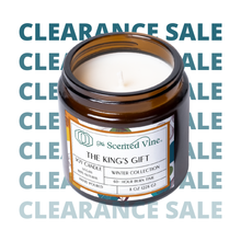 Load image into Gallery viewer, Candle in a brown jar with a label on a white background with 'Clearance Sale' text.
