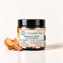Load image into Gallery viewer, Midnight Train to Georgia Soy Candle with small peach and sandalwood piece