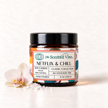 Load image into Gallery viewer, Netflix &amp; Chill Soy Candle with one pale orchid bloom and a pinch of coarse sea salt